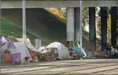  ?? Nelvin C. Cepeda San Diego Union-Tribune ?? A PROPOSED ORDINANCE would ban homeless encampment­s in certain public places in San Diego.