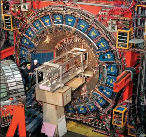  ?? (AP/Fermilab) ?? This undated photo provided by the Fermi National Accelerato­r Laboratory shows the facility’s Collider Detector outside Batavia, Ill. In results released on Thursday, scientists at the lab calculated that the W boson, a fundamenta­l particle of physics, weighs a bit more than their theoretica­l rule book for the universe tells them it should.