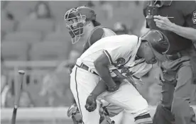  ?? Bazemore) ?? Atlanta Braves’ Ronald Acuna Jr. (13) reacts after being hit by a pitch from Miami Marlins’ Jose Urena during the first inning of a baseball game Aug. 15 in Atlanta. Both dugouts emptied and Urena was ejected. (AP Photo/John