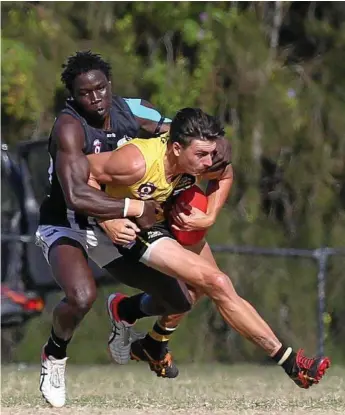  ?? Photo: Regi Varghese ?? FOOTY DREAMS: Majok Aneet (left) of Western Magpies and Jye Warren (right) of Labrador during Aneet’s stint playing in the QAFL.