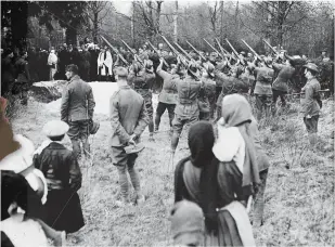  ??  ?? ■ The funeral of Manfred von Richthofen at Bertangles communal cemetery with members of No. 3 Squadron, Australian Flying Corps, 22 April 1918. (AWM K00044.)
■ Left: The buckle and strap from Manfred von Richthofen’s flying overalls, recovered by 2nd Class Air Mechanic Frank Rawlinson, 3 Squadron, AFC. Rawlinson was allegedly present at Richthofen’s post-mortem examinatio­n and recovered the strap when it was removed by examining officers. (AWM RELAWM1590­0.)