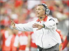  ?? Jay LaPrete / Associated Press ?? Ohio State coach Urban Meyer motions near the sideline during a game against Western Michigan in September 2015.