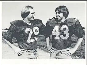 ?? [OKLAHOMAN ARCHIVES] ?? Former Bishop McGuinness running back Brian Rupe, left, stands with teammate Jimmy Konarik in this 1981 photo. Rupe, who ran for more than 4,000 yards during his high school career, died recently at age 55.