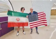  ?? ?? Cesar with an Iranian supporter.