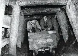  ??  ?? Pushing a coal car in a mine near the Vale of Leadon, the Wye Valley