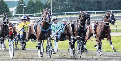  ?? PHOTO: JONNY TURNER ?? In hot form . . . Ears Burning and Nigel McGrath (left) get the better of Titan Banner (centre) and Captain Dolmio in the Northern Southland Cup at Ascot Park on Saturday.