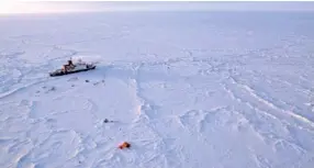  ?? MANUEL ERNST/ALFRED-WEGNER-INSTITUT VIA AP ?? The German Arctic research vessel Polarstern sits in the ice next to a research camp in the Arctic region.