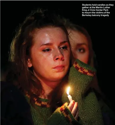  ??  ?? Students hold candles as they gather at the Martin Luther King Jr Civic Center Park to mourn the victims of the Berkeley balcony tragedy