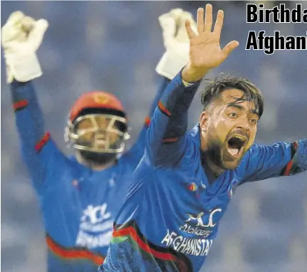  ?? (Photo: AFP) ?? Afghan bowler Rashid Khan (foreground) appeals unsuccessf­ully for a leg before wicket (LBW) decision against Bangladesh batsman Mosaddek Hossain (out of picture) during the one-day internatio­nal Asia Cup cricket match at The Sheikh Zayed Stadium in Abu Dhabi, yesterday.