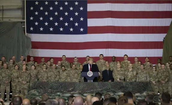  ?? Associated Press ?? President Donald Trump addresses U.S. service members during a surprise Thanksgivi­ng Day visit to Bagram Air Field, Afghanista­n.