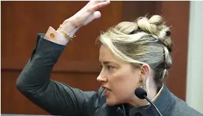  ?? AP Photo/Steve Helber, Pool ?? Actor Amber Heard testifies in the courtroom at the Fairfax County Circuit Courthouse on Monday in Fairfax, Va.