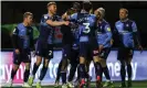  ??  ?? Wycombe’s players celebrate with Adebayo Akinfenwa after his dramatic injurytime winner. Photograph: Kieran Cleeves/PA