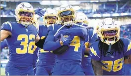  ?? ALLEN J. SCHABEN LOS ANGELES TIMES ?? Defensive backs Nasir Adderley (center) and Alohi Gilman (32) have been major contributo­rs for a resurgent Chargers defense with All-Pro Derwin James Jr. out.