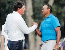  ?? LYNNE SLADKY/THE ASSOCIATED PRESS FILES ?? Phil Mickelson and Tiger Woods have been talking about holding a US$10 million winner-take-all exhibition match, likely at a course in Las Vegas.