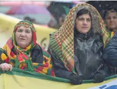  ?? — AFP ?? Kurds wave flags and banners as they take part in a demonstrat­ion asking for the release convicted Kurdistan Worker’s Party (PKK) leader Abdullah Ocalan, in Strasbourg, eastern France, on Saturday.