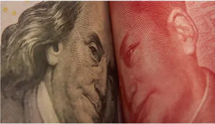  ??  ?? ABOVE With the US and China trading tariffs, China’s devaluatio­n of the yuan has escalated the trade war into a currency war that is threatenin­g to drag the world economy into a global recession