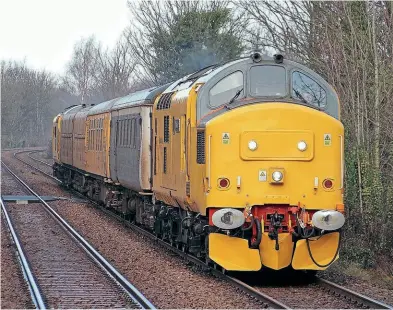  ?? Tim Rogers ?? ABOVE: Network Rail’s 97303 has been named Dave Berry after one of its project managers at Shrewsbury, who passed away in April 2021. 97303 works 3Q15 Coleham to Coleham test train south through Neston on January 11, 2022.