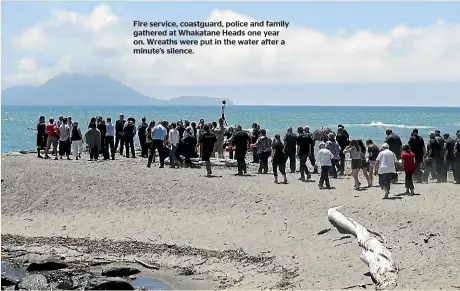  ??  ?? Fire service, coastguard, police and family gathered at Whakatane Heads one year on. Wreaths were put in the water after a minute’s silence.