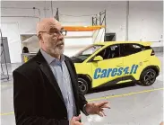  ?? Mike Householde­r/Associated Press ?? Caresoft Global President Terry Woychowski speaks about BYD’s Seagull electric vehicle, which he called a “clarion call” for the U.S. auto industry.