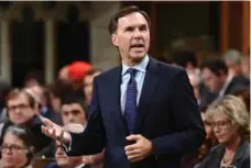  ?? SEAN KILPATRICK/THE CANADIAN PRESS FILE PHOTO ?? Minister of Finance Bill Morneau’s tour of duty in the question period hot seat has been lonesome in more ways than one, Chantal Hébert writes.