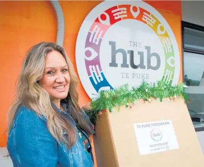  ?? ?? The Hub Te Puke social worker Georgie Attwood with one of the boxes that will be placed in some of the town’s churches and businesses.