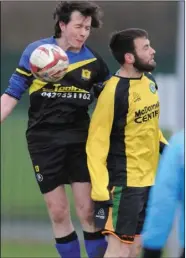  ??  ?? Gerard Collins, Rangers, rises highest against Johnny Reynolds, Lourdes.