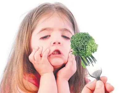  ?? DREAMSTIME ?? Instead of harping on a child to eat new foods, author and parent Dina Rose suggests accustomin­g children to tasting new foods.