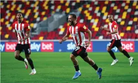  ??  ?? Bryan Mbeumo (centre) celebrates after putting Brentford ahead against Sheffield Wednesday. Photograph: Clive Rose/Getty Images