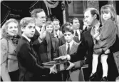  ?? AP FILE ?? Sen. Joe Biden, D- Del., holds his daughter Ashley while taking a mock oath of office from Vice President George Bush during a ceremony on Capitol Hill. Biden’s sons Beau and Hunt hold the Bible during the ceremony on Jan. 3, 1985.