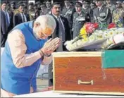  ?? PTI PHOTO ?? Prime Minister Narendra Modi pays tribute to security personnel who lost their lives in Tuesday’s encounter in J&K, at AFS Palam in New Delhi on Wednesday.