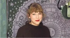  ?? AP ?? Taylor Swift accepted her Artist of the Year award virtually while in a recording studio during Sunday’s American Music Awards.