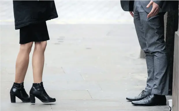  ?? CHRIS J RATCLIFFE / GETTY IMAGES ?? Laws in Britain requiring companies with more than 250 staff to publish the gap between the average woman and average man’s pay in their organizati­on caused a furor in April. Globally the average gap in mean hourly pay is 15.6 per cent in favour of men.