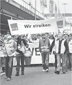  ??  ?? 20-YEAR LOW: Members of the Ver.di labour union march during a strike at Frankfurt airport in Frankfurt in March. Unemployme­nt is near a 20-year low in Germany, but union membership is on the decline as more employees work for temporary agencies. — WPBloomber­g photo