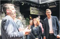  ?? PHOTO: LUISA GIRAO ?? Act New Zealand leader David Seymour talks to supporters in Invercargi­ll yesterday next to Act list MPs Toni Severin (centre) and Simon Court.