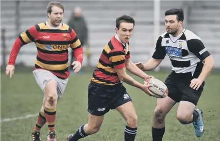  ??  ?? Sunderland’s second XV (red, yellow and black hoops) battle against Houghton Boars on Saturday. Pictures by Tim Richardson.