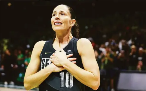  ?? Lindsey Wasson / Associated Press ?? Seattle Storm guard Sue Bird reacts to fans chanting “Thank you Sue” after the Storm were eliminated from the playoffs with a loss in Game 4 of a WNBA basketball playoff semifinal to the Las Vegas Aces on Tuesday in Seattle.