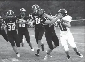  ?? Jan Osborn ?? Waylon McBride of Twin Loup stiff arms Ansley-Litchfiled­s Gavin Cole Sept.25. McBride had one rushing touchdown in the game.