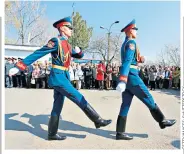  ??  ?? OUT OF STEP
Soldiers march ceremoniou­sly in Tiraspol, above; the land of the Lada, below left; a folk musician, below; Cricova Winery’s cellars, right