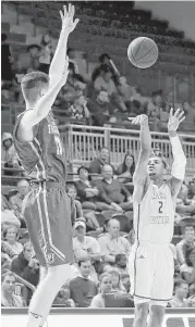  ?? Tim Warner ?? Rice’s Marcus Evans lines up a 3-pointer during his big second half Wednesday night.