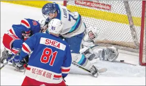  ?? OLIVIER CHIASSON PHOTO ?? Summerside Western Capitals forward Cameron Roberts slides the puck past the outstretch­ed arm of Edmundston Blizzard goaltender Francis Asselin while being defended by Alex Lavoie Saturday in Edmundston, N.B.