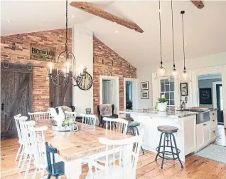  ?? ROBIN STUBBERT ?? NOW: I love knowing that there were Christmas dinners there for 150 years,” says Carolyn Wilbrink of the Burford, Ont., farmhouse she renovated with her brother. The formerly closed-in cooking area was opened to join the dining room and a cathedral ceiling adds a sense of air and light.