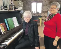  ??  ?? Bobby McLean, left, and Lois Miller, granddaugh­ter of the original owner, with the piano, which has dozens of small indentatio­ns left by shattered glass on the side that had faced the shop window during the Halifax Explosion.