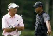  ?? STEW MILNE — THE ASSOCIATED PRESS ?? In this file photo, Tiger Woods, right, talks with Seth Waugh, CEO Deutsche Bank Americas, during the proam round of the Deutsche Bank Championsh­ip in Norton, Mass. Waugh is taking over as CEO of the PGA of America.