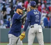  ?? ?? The Rays’ Harold Ramirez, left, and Yandy Díaz high-five after defeating the Angels in 10innings on Wednesday.