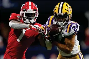  ?? AP PHOTO BY JOHN BAZEMORE ?? In this Dec. 7, 2019, file photo, LSU cornerback Derek Stingley Jr. (24) intercepts the ball from Georgia wide receiver George Pickens (1) during the second half of the Southeaste­rn Conference championsh­ip NCAA college football game in Atlanta. Stingley Jr. was selected to The Associated Press preseason All-america first-team, Tuesday, Aug. 25.