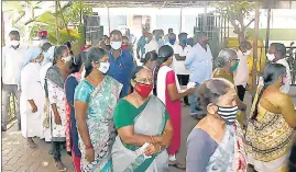  ??  ?? Voters stand in the queue to cast their votes in Puducherry on April 6.