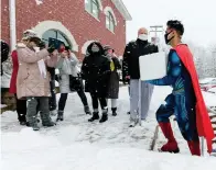  ?? Chorus Photograph­y/Associated Press ?? ■ Skippack Pharmacy owner and pharmacist Dr. Mayank Amin, dressed in his trademark superhero costume, arrives on Feb. 7 in the middle of a snowstorm with vials of COVID-19 vaccine for their first vaccinatio­n clinic in Skippack, Pa. In communitie­s across the country, local pharmacy owners are among the people administer­ing COVID-19 vaccinatio­ns.