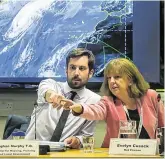  ?? PHOTO: GARETH CHANEY ?? Closing in: Housing Minister Eoghan Murphy and Met Éireann’s Evelyn Cusack track Hurricane Lorenzo’s progress.