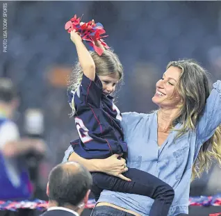  ??  ?? Brady’s wife Gisele Bundchen and their daughter Vivian celebrate after the Patriots’ victory.