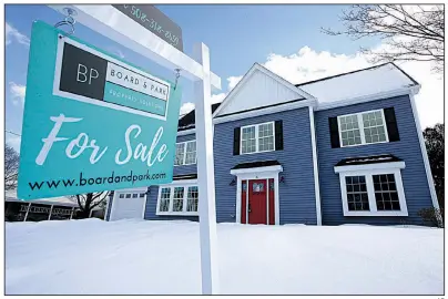  ?? AP ?? Sales of new U.S. homes like this one in Natick, Mass., fell to an annualized rate of 607,000 in January. Homebuying declined in the Northeast, Midwest and South but rose in the West.